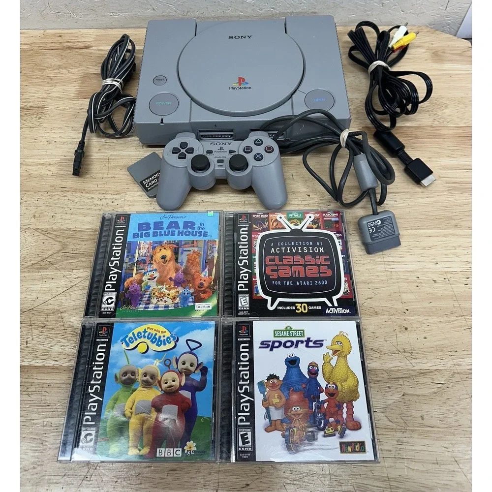 Sony PlayStation Console with DualShock Controllers Cables 4 Games SCPH-7501